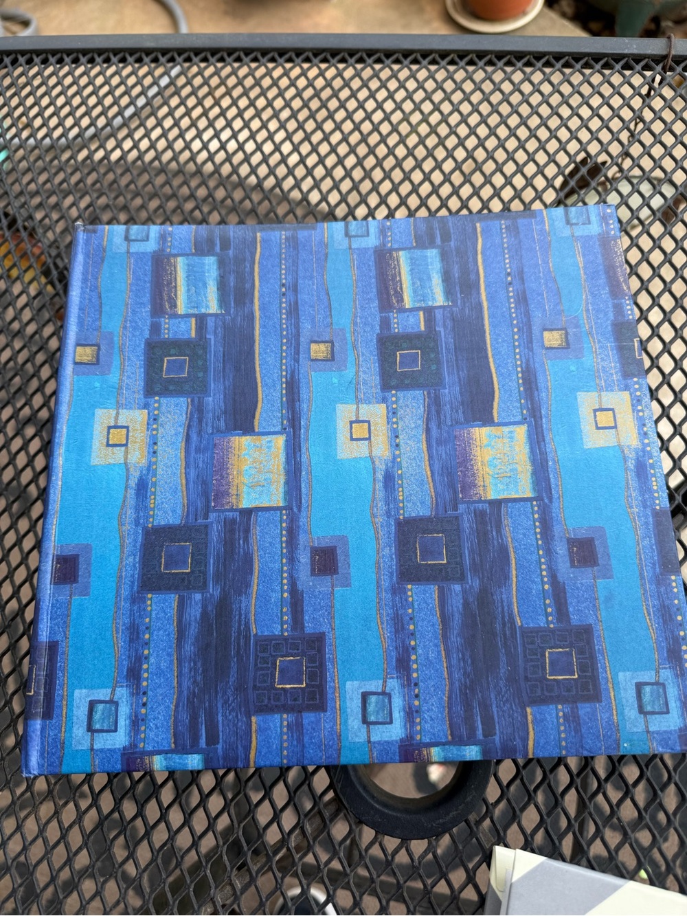 Stylish abstract photo album featuring blue and purple geometric patterns.